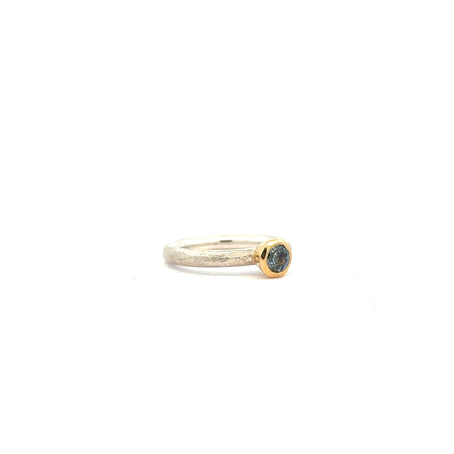 Blue Round Cut Parti Sapphire Ring on a Silver Band