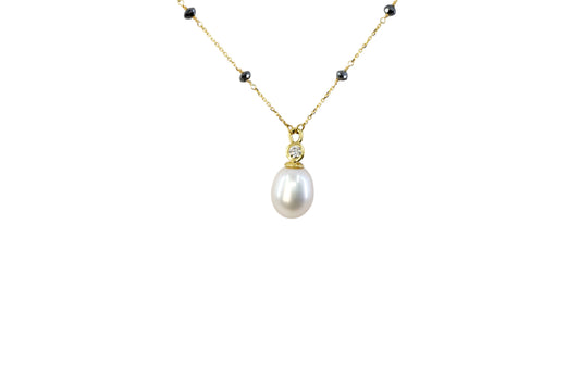 Pearl and diamond pendant on a Black diamond chain