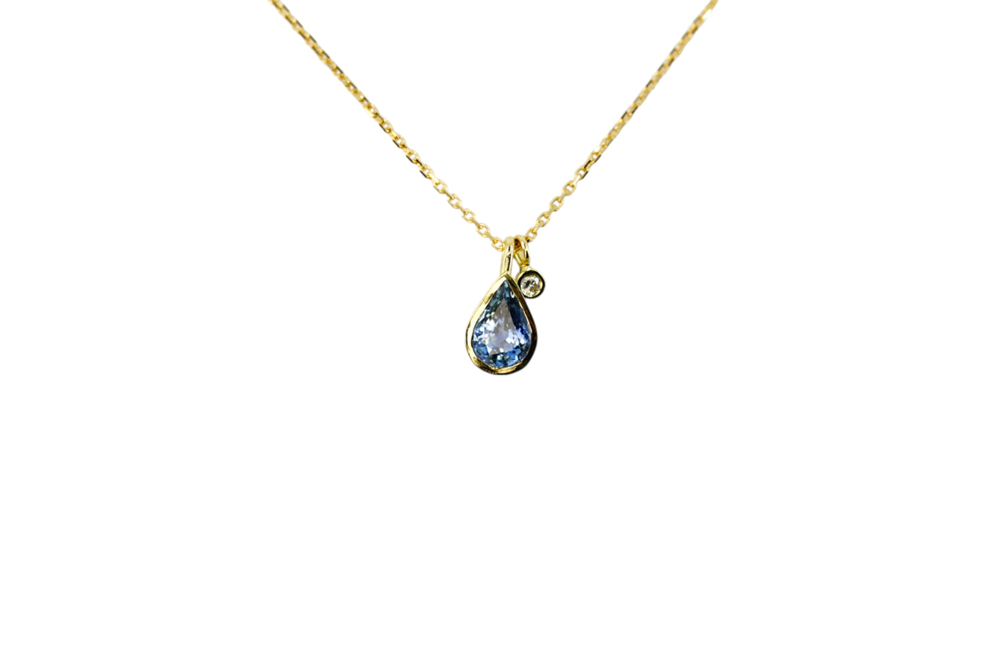 Pear cut blue sapphire and diamond charm necklace
